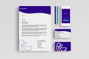 Mockup of letterhead, pencils, business cards and web app with appella branding.